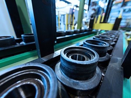 We manufacture track adjusters and rollers for agricultural machinery and houses track chain assembly lines