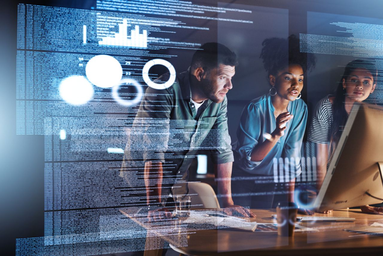 Three Data Scientists in front of screen with digital dashboard of Condition Monitoring